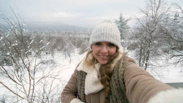 Beautiful-Woman-Telling-about-Winter-Nature-in-National-Park