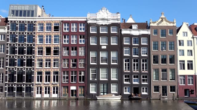 Historic-building-in-Amsterdam,-gable,-front,-town-canal,-Netherlands,-4K