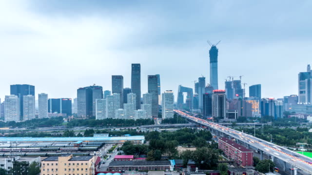 Zeitraffer-von-Jianwai-SOHO,-der-CBD-Skyline-von-Tag-zu-Nacht-in-Peking,-China
