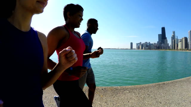 Multi-Ethnic-American-male-and-females-running-together