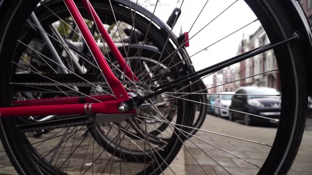 Bikes-parking-in-Amsterdam.wheel-close-up