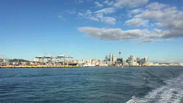 and-city-skyline-as-view-from-a-ferry-sailing-over-Waitemata-harbour-New-Zealand