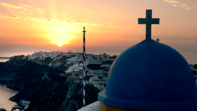 close-up-at-sunset-of-a-church-dome-in-oia,-santorini