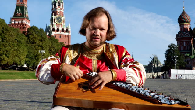 Portrait-of-a-musician-with-music-instrument-gusli