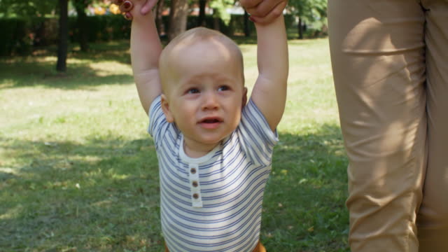 Baby-Boy-Learning-to-Walk-Outdoors