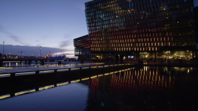 Tourist-Taking-Pictures-of-Galeria-Harpa,-Timelapse