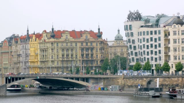 amazing-architecture-of-Prague-in-quay-of-Vltava-river,-bright-facades-of-buildings,-in-summer-day