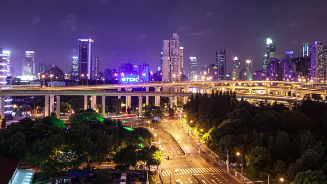 TL,-WS-Rush-hour-traffic-on-multiple-highways-and-flyovers-at-night-/-Shanghai,-China