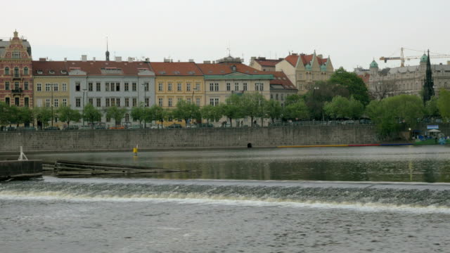 View-of-Prague-cityscape-moving-along-the-Vltava-river-on-boat,-Czech-Republic