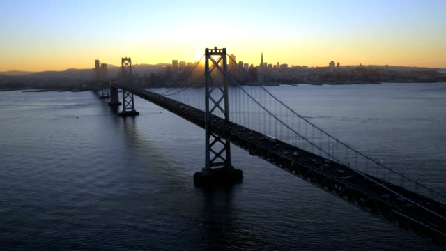 Aerial-sunset-view-Oakland-Bay-Bridge-San-Francisco