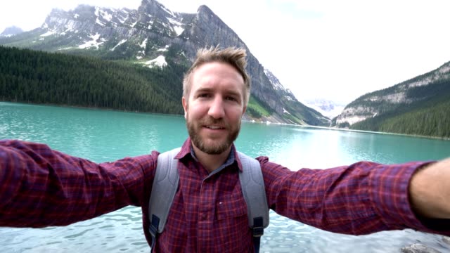 Hiker-capturing-selfie-portrait-at-Lake-Louise