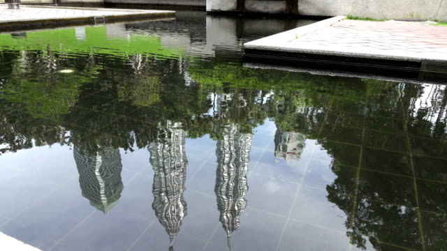 Reflection-in-water-Petronas-twin-towers-in-Kuala-Lumpur,-Malaysia