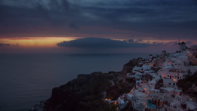 panorama-de-la-costa-de-puesta-de-sol-cielo-santorini-isla-oia-ciudad-Bahía-4-tiempo-k-caer-Grecia