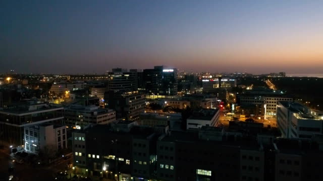 Night-city-aerial-establishing-shot