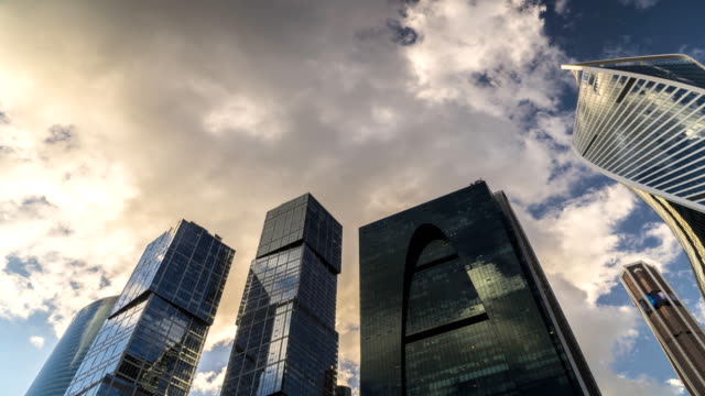 bottom-up-view-of-rotating-skyscrapers-and-flying-clouds,time-lapse,-hyper-lapse