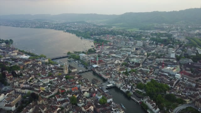 sunset-time-zurich-cityscape-central-riverside-aerial-panorama-4k-switzerland
