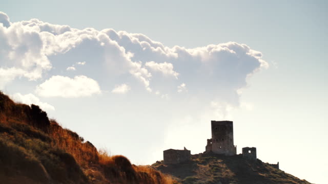 Stone-old-tower-house-on-Mani,-Greece.-Time-lapse