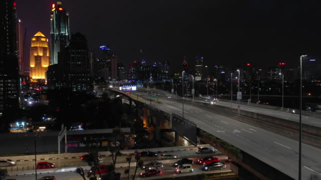 night-illuminated-kuala-lumpur-downtown-traffic-road-junction-aerial-panorama-4k-malaysia