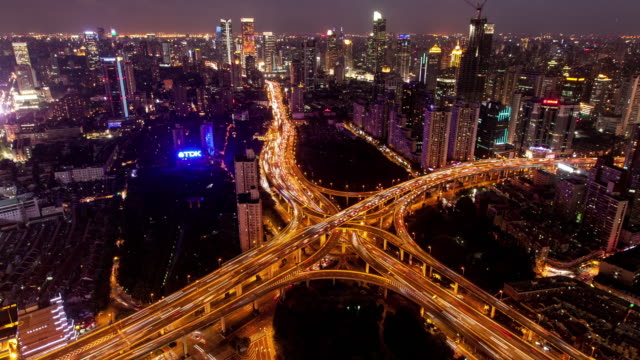 TL,-WS-Rush-hour-traffic-on-multiple-highways-and-flyovers-at-night-/-Shanghai,-China