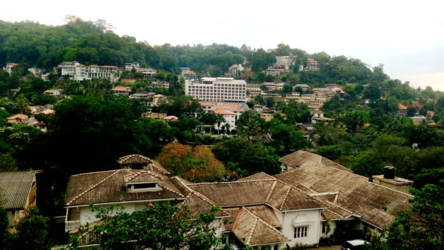 Peaceful-green-resort-town,-beautiful-cityscape,-old-buildings-among-trees