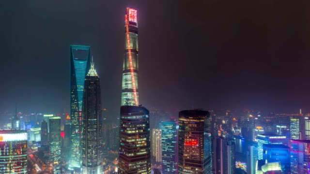 Time-lapse-of-Shanghai's-three-tallest-skyscrapers,-the-Shanghai-World-Financial-Center,-the-Jin-Mao-Tower,-and-the-Shanghai-Tower-at-sunset