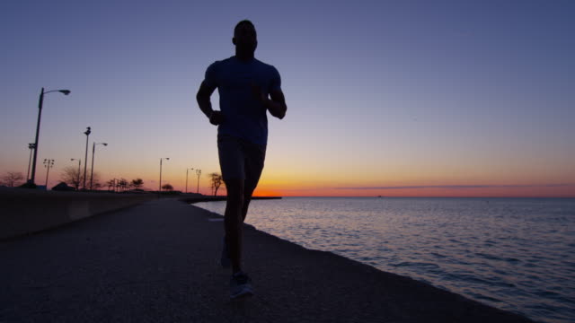 Ethnic-African-American-male-silhouette-running-at-sunrise
