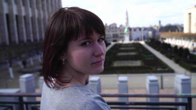 tourist-girl-walks-and-looks-at-attractions-in-the-city-of-Brussels-Belgium.-slow-motion