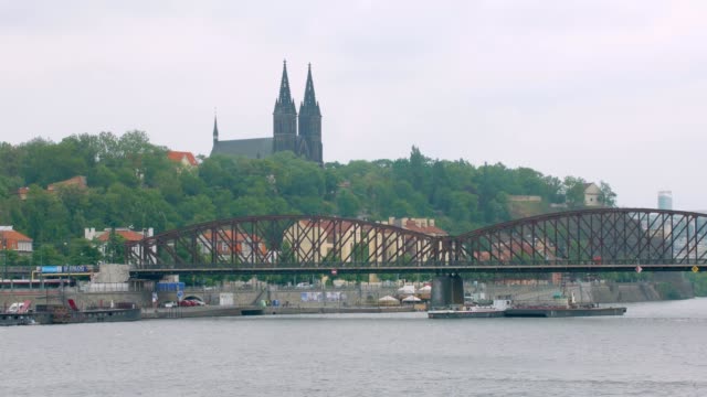 old-railway-bridge-and-ancient-castle-in-Prague,-view-in-cloudy-day