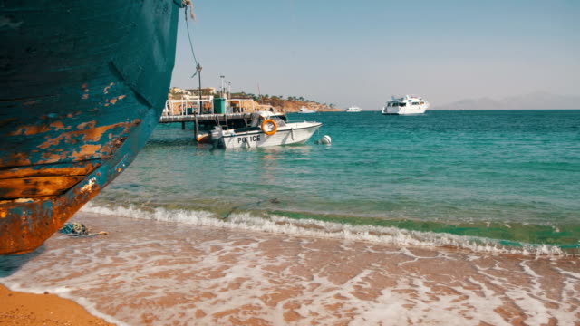 Beach-in-Egypt.-Resort-Red-Sea-Coast.-Coast-guard-boat-near-the-seaport