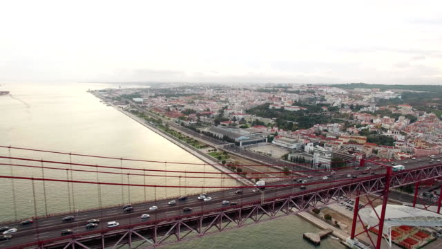 Cars,-trains,-bus-on-25-April-bridge-in-Lisbon-aerial-view
