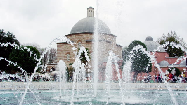 Hagia-Sophia-view-with-water-fountain-in-Sultanahmet-square,-Istanbul,-Turkey