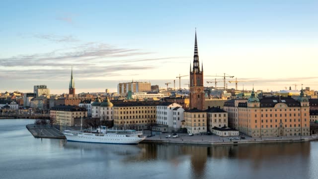 Stockholm-city-skyline-timelapse-at-Gamla-Stan-and-Slussen,-Stockholm-Sweden-4K-Time-Lapse