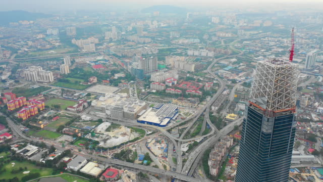 evening-kuala-lumpur-downtown-megatall-construction-traffic-road-aerial-panorama-timelapse-4k-malaysia