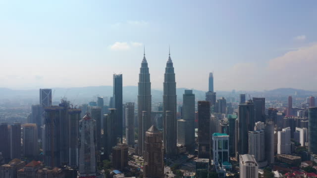 sunny-day-kuala-lumpur-city-downtown-famous-towers-aerial-panorama-4k-malaysia