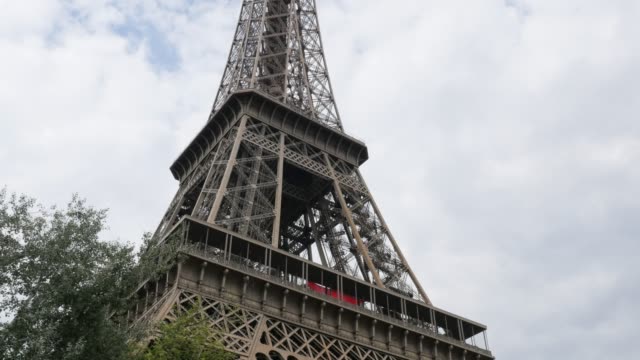 Monument-Eiffel-tower-in-Paris-France-by-the-day-in-front-of-sky-and-clouds-4K-2160p-30fps-UHD-footage---Beautiful-and-recognizable-Eiffel-tower-4K-3840X2160-UltraHD-video