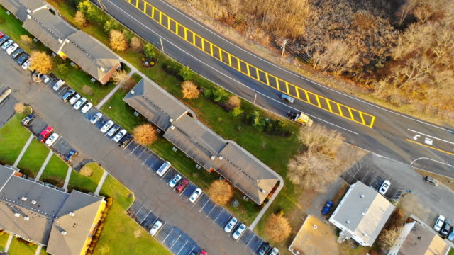 Houses-look-like-a-miniature-village,-aerial-view-of-traditional-housing-estate-in-USA.-Looking-straight-down-with.