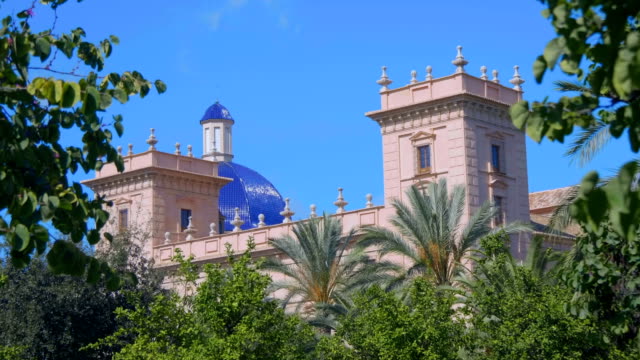 Beautiful-blue-dome-and-towers-of-an-ancient-church,-temple-near-the-park