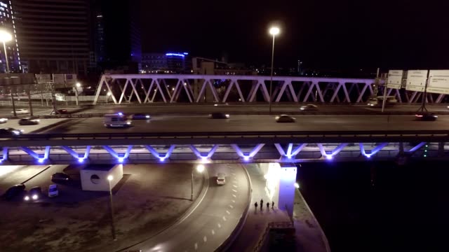 Aerial-night-highway-bridge-passing-cars