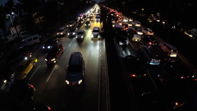 Rush-hour-night-traffic-of-vehicles-passing-six-lane-road.-aerial
