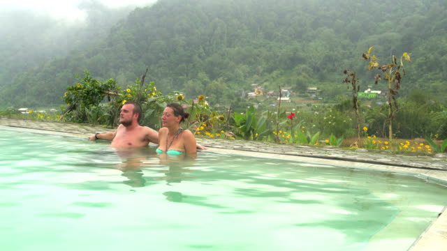 A-man-and-a-woman-relaxing-in-a-hot-spring