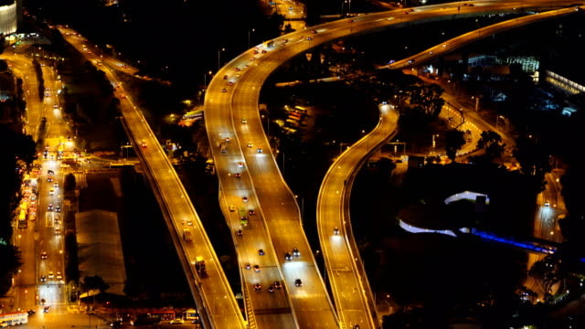 Cars-driving-on-roads-and-highways-in-Singapore-City-at-night-in-transportation-concept