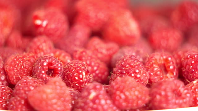 Fresh-sweet-raspberries-turning-around.-Ripe-raspberry-fruit-background.