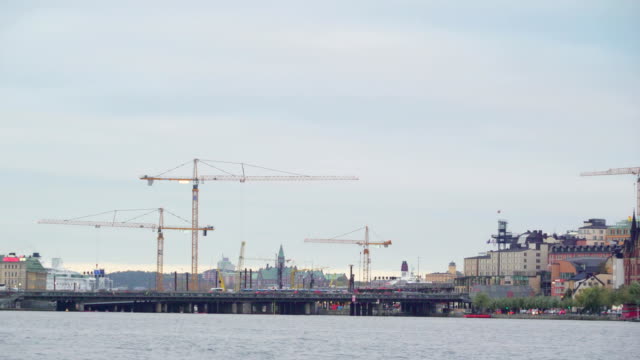 View-of-the-tower-cranes-and-the-bridge-in-Stockholm-Sweden