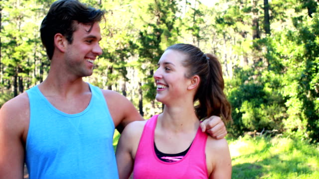 Smiling-athletic-couple-jogging-together