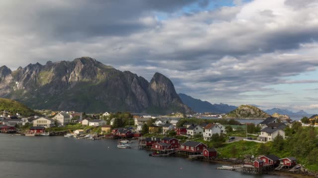 Time-lapse-view-of-Reine-fishing-village-with-mountain-range-in-the-background