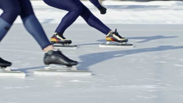 Athletes-Skating-on-Outdoor-Ice-Rink