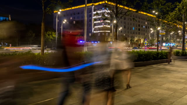 the-flow-of-pedestrians-and-cars-following-the-city-street,-time-lapse
