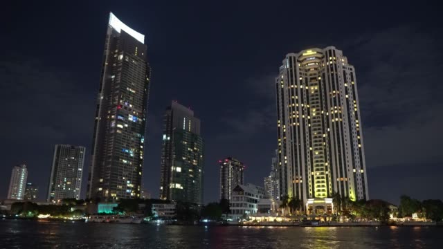 night-city-view-with-office-buildings-on-the-river-bank.-metropolitan-business-district