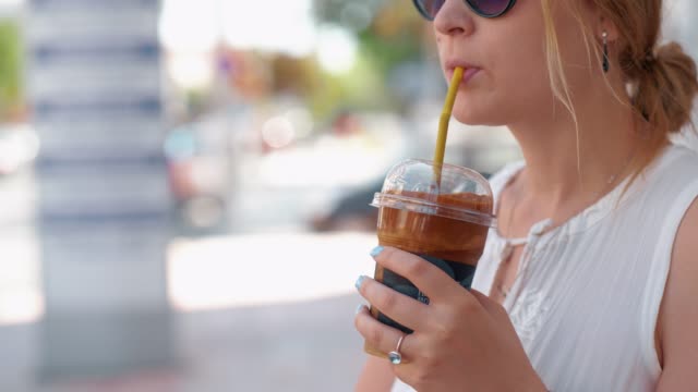 Woman-having-chocolate-drink-in-the-street