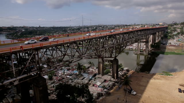 Aerial-shooting-a-bridge-on-the-background-of-urban-slum-(Dominican-Republic)